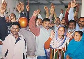 Class IV employees protest in support of their demands at the MC office in Sector 17, Chandigarh