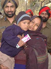 Six-year-old Ronek, who was kidnapped from Hoshiarpur, is reunited with his mother by the rescuing police team in Jalandhar on Wednesday