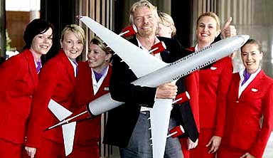 Sir Richard Branson poses with Virgin Atlantic crew at a luncheon in Sydney, Australia, on Thursday