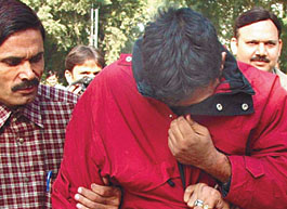 The accused in police custody in the Capital on Thursday. 
