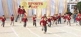 Children take part in a race during the annual sports meet of Everest Public School