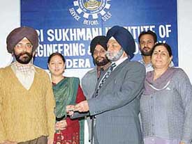 Prof Avtar Singh, Chairman of the SSIET, presents a cheque for Rs 1 lakh for the Prime Ministers National Relief Fund to the Principal, Dr I.P. Singh, in Dera Bassi on Friday. 