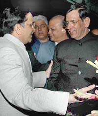 The Chief Justice of India, Mr Justice Y.K. Sabharwal (right), is received by Chief Justice of the Punjab and Haryana High Court D.K. Jain on his arrival at Chandigarh railway station on Friday. 