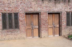 The locked house of Joginder Kaur and Darshan Singh, the couple who died from AIDS this year, in Mansoorwal Bet in Kapurthala