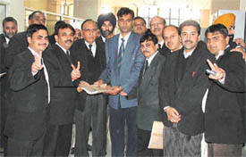 A candidate filing nomination papers with the returning officer for the post of secretary of the District Bar Association