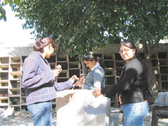 HAMMER & TONG: girls working on a stone sculpture. Photos by writer
