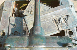 NOTHING BUT ITS PRIDE LEFT: The tank being ripped apart piece by piece