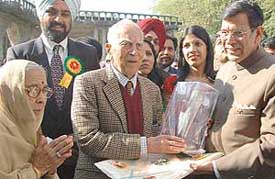 The Chief Justice of India, Mr Justice Y.K. Sabharwal, presents a memento to senior advocate H.L. Sibal at a function organised by the Punjab and Haryana High Court Bar Association in Chandigarh on Saturday. 