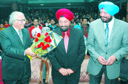 The Principal of Lyallpur Khalsa College, Dr Satish Kapoor, welcomes former Union Minster, Mr B.S. Ramoowalia, at a UGC workshop in Jalandhar on Saturday. To his right is former MP, Mr Balbir Singh.