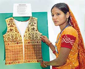 A recipient of the Master Weaver National Award, Ms Bhamben Maghabhai Valsu from Tharad (Gujarat), shows her soof kharak embroidery work in New Delhi on Sunday.
