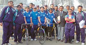 Cyclists and officials from Pakistan who have come to take part in the 25th BSA Asian Cycling Championship pose for a frame during the road race held at the stretch between Doraha and Khanna on Sunday.