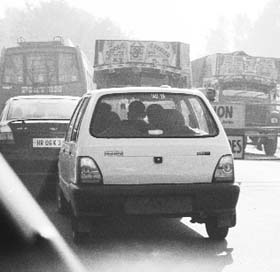 A car at a checkpost near Jammu, with the rear licence plate missing