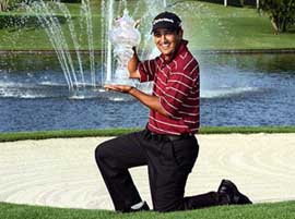 Indias Shiv Kapur holds the trophy after winning the Volvo Masters of Asia golf event at the Thai Country Club in Bangkok on Sunday.