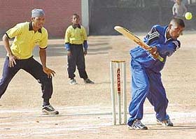 A special child plays a shot during the first All-India Cricket Tournament for Mentally Challenged Children held at St Annes grounds in Sector 32
