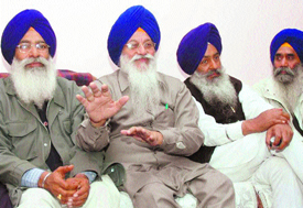 Avtar Singh Makkar (second from left), President, SGPC, talks to media persons in Jalandhar on Monday.