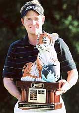 Luke Donald of England holds the trophy after winning the Target World Challenge golf tournament at Sherwood Country Club in Thousand Oaks, California, on Sunday
