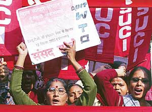 Activists from Left parties shout anti-World Trade Organisation slogans
