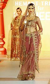 A model presents a creation by designer Hemant Trivedi in Manama, Bahrain, on Tuesday night