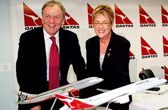 CEO of Qantas Airways Ltd Geoff Dixon and Qantas chairperson Margaret Jackson display the new Boeing 787 in the designs of Qantas and its low-cost offshoot, Jetstar International, during a press conference in Sydney on Wednesday