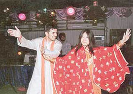 Kabir Tewari and his Chinese bride Kimberly dance the Punjabi way at their wedding in town
