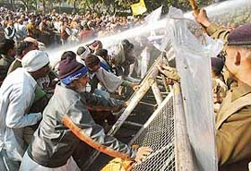 Retrenched employees of Haryana Government braving water canons of the police during a protest at Matka Chowk in Sector 17, Chandigarh