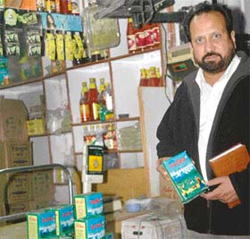An official of the Health Department shows the spurious packets of Verka ghee seized by the department in Burail, Chandigarh