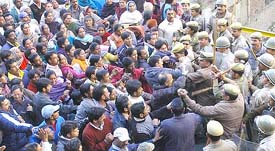 Owners of the demolished structures hold a protest rally in Shimla on Thursday. The Municipal Corporation has demolished as many as 200 structures during the past two days under orders from the High Court. 