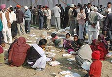 Villagers have a feast at the wedding reception of the son of Jalandhar MP Rana Gurjit Singh in Kapurthala on Thursday.