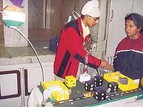 A student displays his model at the state-level science exhibition held at Atam Public School