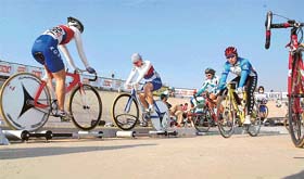 Cyclists warm up prior to an event during the 25th Asian Cycling Championship being held at Punjab Agricultural University Velodrome, Ludhiana