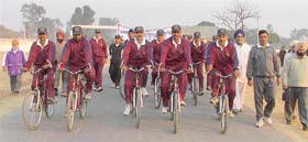 Members of the cycling expedition of Bombay Sappers are escorted by officials at Ludhiana