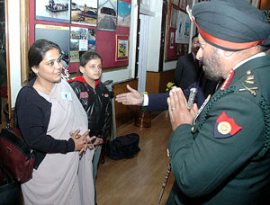 Chief of Army Staff Gen J.J. Singh meets a war widow on the eve of Vijay Divas at Kashmir House in New Delhi on Thursday.