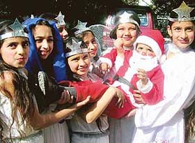 Students of Saint Xaviers School celebrate Christmas on the school premises in Mohali