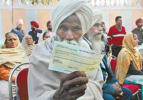 Wish I had my son instead of this cheque: Mr Surjit Singh, a Kargil martyrs father, shows a cheque given to him on Vijay Divas in Ludhiana