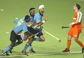 Sandeep Singh celebrates with his team-mates after scoring a goal against the Netherlands during their match in the Champions Trophy in Chennai on Friday.