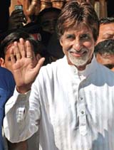 Amitabh Bachchan waves to his fans as he leaves Lilavati Hospital in Mumbai on Saturday.