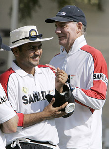 Greg Chappell shares a lighter moment with Virender Sehwag during a practice session at the Sardar Patel Gujarat Stadium in Ahmedabad on Saturday. The third and final Test between India and Sri Lanka begins on Sunday.