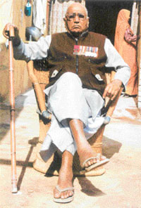 A file photo of Hony Capt Umrao Singh in front of his house in Palara village nearJind in Haryana