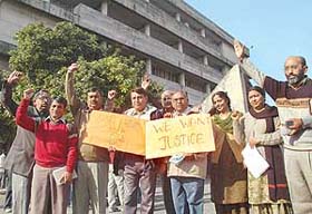 Faculty of Dhanvantri Ayurvedic College, Sector 46, Chandigarh, protesting against the management of college outside the Senate meeting