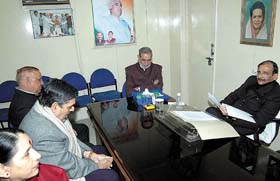 Delhi Congress president Ram Babu Sharma holding a meeting with MPs and the Mayor on the issue of demolition drive at the DPCC office in the Capital