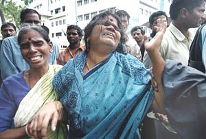 Meena (centre) mourns the death of her husband outside the mortuary at G H Hospital in Chennai on Sunday. 
