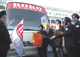 The SGPC president, Mr Avtar Singh, flags off the Roko cancer bus at the Golden Temple in Amritsar on Sunday.
