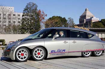 Japans Prime Minister Junichiro Koizumi takes a ride in the eight-wheeled electric car, Eliica, in Tokyo on Monday