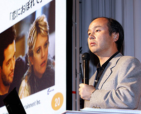 Softbank President Masayoshi Son speaks at a press conference in Tokyo on Monday. Softbank and Yahoo! Japan announced a joint venture to form a TV Bank for a video service portal site