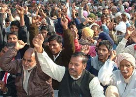 Members of the Pendu Mazdoor Union hold a protest rally in Jalandhar