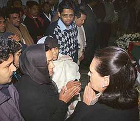 Congress President Sonia Gandhi with grieving family members of Union Power Minister P M Sayeed, who died in Seoul on Sunday, in New Delhi on Tuesday. 