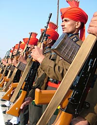 Army jawans salute the martyrs on the occasion of Vijay Divas at Khasa recently.
