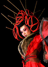 A model shows off a hairstyle and beauty creation by a Chinese designer at a show in Beijing on Tuesday