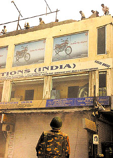 MCD workers razing a building at Vikas Marg in the Capital on Wednesday