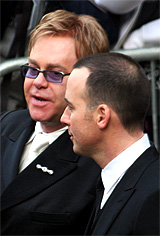 British pop star Elton John and his partner David Furnish arrive at the Guildhall in Windsor, southern England, for their civil ceremony on Wednesday